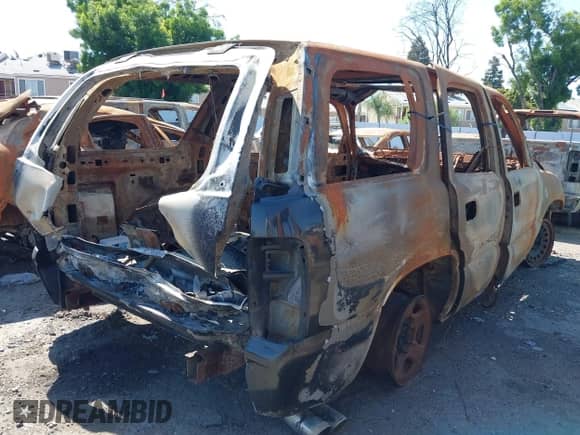 2005 Chevrolet Tahoe LT with VIN 1GNEC13T35R103223, listed as a IAAI auction lot 42165644 with Not provided miles and . Bid and sale history available at DreamBid. Image 6.