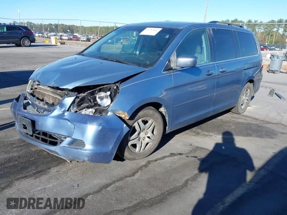 ✅ 2007 Honda Odyssey EX • VIN: 5FNRL38467B036519 • Lot: 43702862. Listed on IAAI with 218,014 mi. Free auction sales archive from the USA and detailed vehicle history report at DreamBid. Image 2.