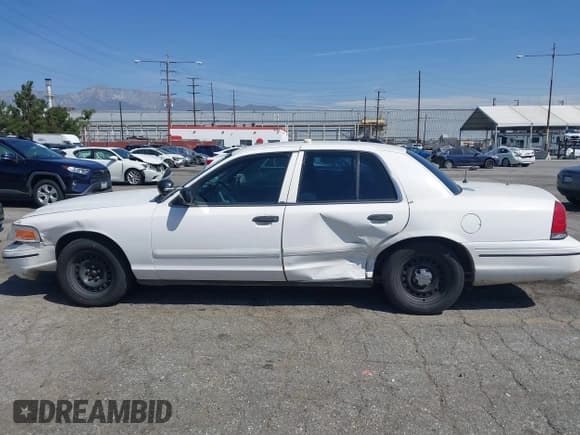 ✅ 1999 Ford Crown Victoria Police • VIN: 2FAFP71W1XX200937 • Лот: 41977836. Опубликован ранее на IAAI с пробегом 186 379 миль. Бесплатный доступ к архиву аукционных продаж из США и подробный отчёт об истории автомобиля на DreamBid. Изображение 14.