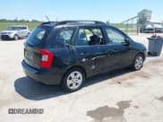 ✅ 2009 Kia Rondo LX • VIN: KNAFG528597278836 • Lot: 42662432. Listed on IAAI with 103,854 mi. Free auction sales archive from the USA and detailed vehicle history report at DreamBid. Image 4.