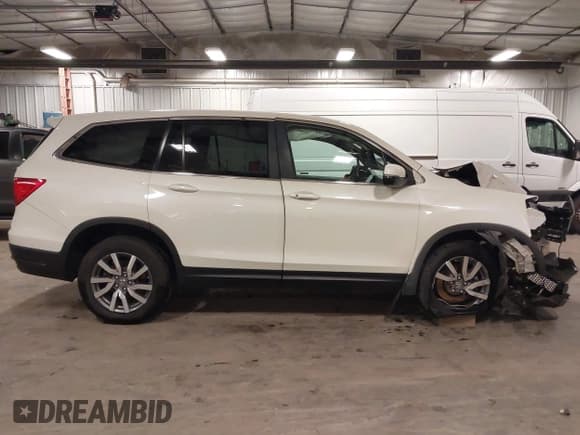 ✅ 2019 Honda Pilot EX-L • VIN: 5FNYF6H43KB023739 • Lot: 43177743. Listed on IAAI with 106,079 mi. Free auction sales archive from the USA and detailed vehicle history report at DreamBid. Image 14.