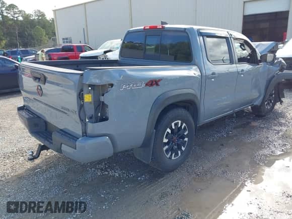 2022 Nissan Frontier Pro-4X z VIN 1N6ED1EK0NN620249, wystawiony jako IAAI lot #43387462 z przebiegiem 92 659 mil mil oraz . Historia ofert i sprzedaży dostępna na DreamBid. Obrazek 4.