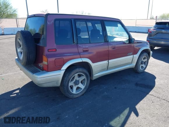 ✅ 1998 Suzuki Sidekick • VIN: JS3TD21V2W4109389 • Lot: 43534824. Listed on IAAI with 197,635 mi. Free auction sales archive from the USA and detailed vehicle history report at DreamBid. Image 4.