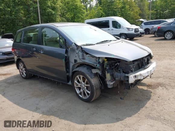 ✅ 2012 Mazda 5 Touring • VIN: JM1CW2CL5C0126744 • Lot: 42385667. Listed on IAAI with 140,150 mi. Free auction sales archive from the USA and detailed vehicle history report at DreamBid. Image 1.