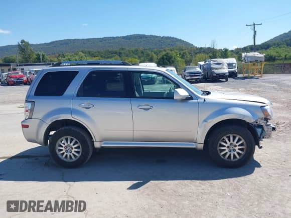 2010 Mercury Mariner Premier z VIN 4M2CN9HGXAKJ16116, wystawiony jako IAAI lot #43140056 z przebiegiem 194 370 mil mil oraz . Historia ofert i sprzedaży dostępna na DreamBid. Obrazek 14.