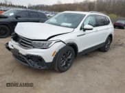 ✅ 2023 Volkswagen Tiguan SE • VIN: 3VVNB7AX4PM100180 • Lot: 42062208. Listed on IAAI with 12,922 mi. Free auction sales archive from the USA and detailed vehicle history report at DreamBid. Image 2.