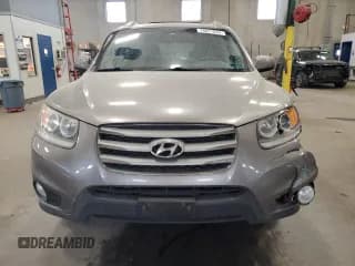✅ 2012 Hyundai Santa Fe SE • VIN: 5XYZH4AG2CG108198 • Lot: 76877024. Listed on Copart with 190,609 mi. Free auction sales archive from the USA and detailed vehicle history report at DreamBid. Image 5.