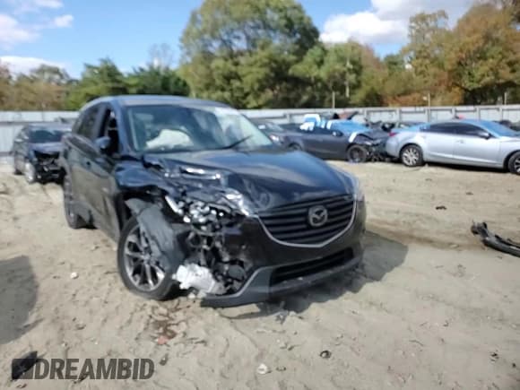 ✅ 2016 Mazda CX-5 Grand Touring • VIN: JM3KE4DY9G0764433 • Lot: 82728825. Wystawiony na Copart z przebiegiem 166 905 mil. Bezpłatny archiwum sprzedaży aukcyjnych z USA i szczegółowy raport historii pojazdu na DreamBid. Zdjęcie 14.