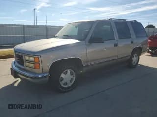 ✅ 1999 GMC Yukon • VIN: 1GKEC13R3XJ806033 • Lot: 80365934. Listed on Copart with 154,984 mi. Free auction sales archive from the USA and detailed vehicle history report at DreamBid. Image 1.