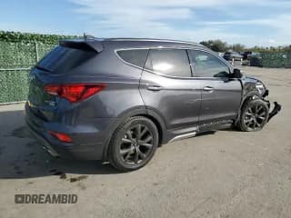 ✅ 2018 Hyundai Santa Fe Ultimate • VIN: 5XYZW4LA9JG571273 • Лот: 82132553. Опубликован ранее на Copart с пробегом 34 774 миль. Бесплатный доступ к архиву аукционных продаж из США и подробный отчёт об истории автомобиля на DreamBid. Изображение 3.