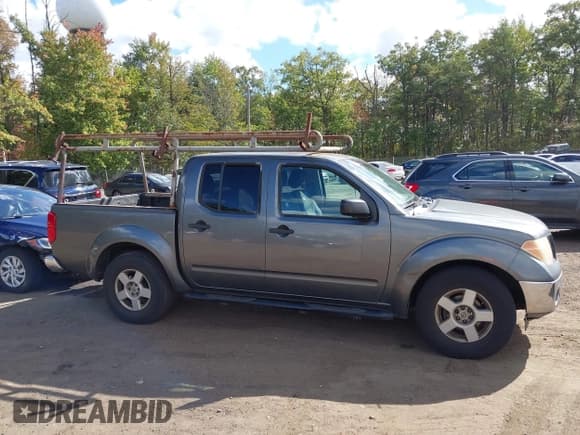 ✅ 2006 Nissan Frontier SE • VIN: 1N6AD07U76C458849 • Лот: 43412646. Опубликован ранее на IAAI с пробегом 254 789 миль. Бесплатный доступ к архиву аукционных продаж из США и подробный отчёт об истории автомобиля на DreamBid. Изображение 13.