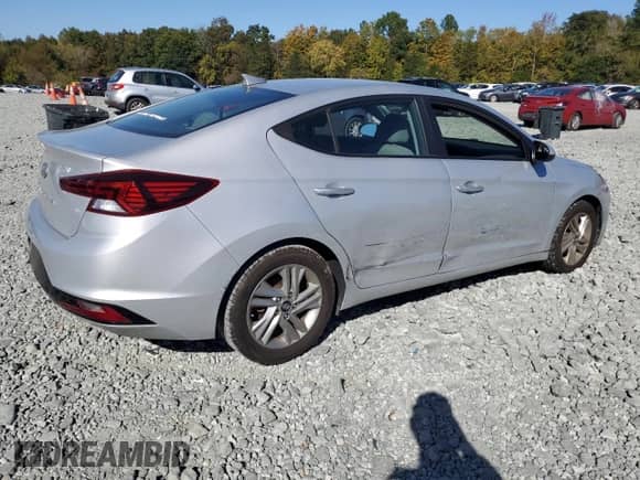 2019 Hyundai Elantra Limited with VIN KMHD84LF6KU812945, listed as a Copart auction lot 82548735 with 104,127 mi miles and Salvage title. Bid and sale history available at DreamBid. Image 3.