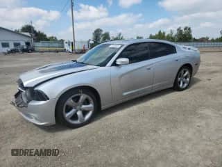 2012 Dodge Charger SXT with VIN 2C3CDXHG9CH194690, listed as a Copart auction lot 71520645 with 142,656 mi miles and Salvage title. Bid and sale history available at DreamBid. Image 1.