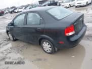 ✅ 2005 Chevrolet Aveo LT • VIN: KL1TG52605B480079 • Lot: 41757862. Wystawiony na IAAI z przebiegiem 163 561 mil. Bezpłatny archiwum sprzedaży aukcyjnych z USA i szczegółowy raport historii pojazdu na DreamBid. Zdjęcie 3.