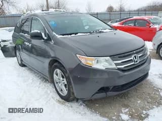 ✅ 2012 Honda Odyssey Touring • VIN: 5FNRL5H95CB049148 • Lot: 43831103. Listed on IAAI with 288,928 mi. Free auction sales archive from the USA and detailed vehicle history report at DreamBid. Image 1.