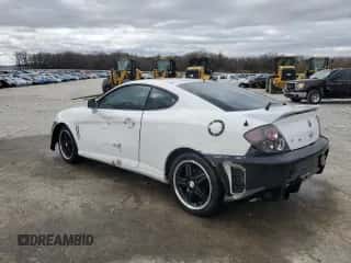 2003 Hyundai Tiburon z VIN KMHHM65D53U042971, wystawiony jako Copart lot #86919434 z przebiegiem 202 250 mil mil oraz Szkoda całkowita • Salvage title. Historia ofert i sprzedaży dostępna na DreamBid. Obrazek 2.