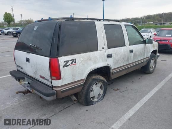 ✅ 1997 GMC Yukon • VIN: 1GKEK13R2VJ739795 • Lot: 42011678. Listed on IAAI with 185,306 mi. Free auction sales archive from the USA and detailed vehicle history report at DreamBid. Image 4.