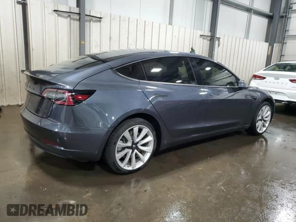 ✅ 2018 Tesla Model 3 Long Range Battery • VIN: 5YJ3E1EBXJF090615 • Лот: 92650005. Опубликован ранее на Copart с пробегом 65 939 миль. Бесплатный доступ к архиву аукционных продаж из США и подробный отчёт об истории автомобиля на DreamBid. Изображение 3.