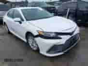 2022 Toyota Camry LE with VIN 4T1R11BK3NU064246, listed as a IAAI auction lot 43037907 with 64,971 mi miles and . Bid and sale history available at DreamBid. Image 1.