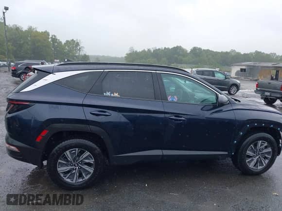 2023 Hyundai Tucson Blue z VIN KM8JBCA10PU092863, wystawiony jako IAAI lot #43233471 z przebiegiem 53 213 mil mil oraz . Historia ofert i sprzedaży dostępna na DreamBid. Obrazek 14.