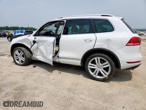 ✅ 2013 Volkswagen Touareg Exec • VIN: WVGEF9BP3DD012463 • Lot: 57499915. Listed on Copart with 104,981 mi. Free auction sales archive from the USA and detailed vehicle history report at DreamBid. Image 2.