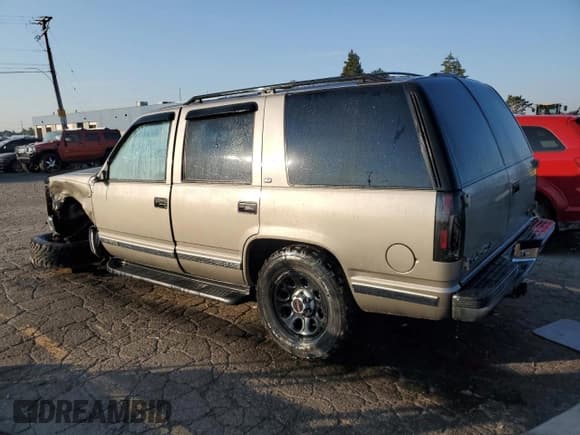 ✅ 1999 GMC Yukon • VIN: 1GKEK13R9XJ803849 • Lot: 69962255. Wystawiony na Copart z przebiegiem 241 641 mil. Bezpłatny archiwum sprzedaży aukcyjnych z USA i szczegółowy raport historii pojazdu na DreamBid. Zdjęcie 2.