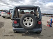 ✅ 2002 Jeep Wrangler Sahara • VIN: 1J4FA59S12P761276 • Lot: 90629975. Listed on Copart with 160,977 mi. Free auction sales archive from the USA and detailed vehicle history report at DreamBid. Image 6.