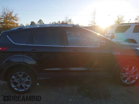 ✅ 2015 Ford Escape Titanium • VIN: 1FMCU9J96FUB23219 • Lot: 43695680. Listed on IAAI with 146,990 mi. Free auction sales archive from the USA and detailed vehicle history report at DreamBid. Image 13.