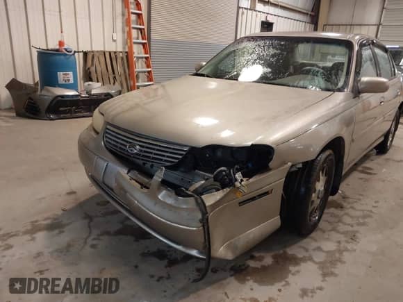 1999 Chevrolet Malibu LS z VIN 1G1NE52M4X6194441, wystawiony jako IAAI lot #41577551 z przebiegiem 94 386 mil mil oraz . Historia ofert i sprzedaży dostępna na DreamBid. Obrazek 6.