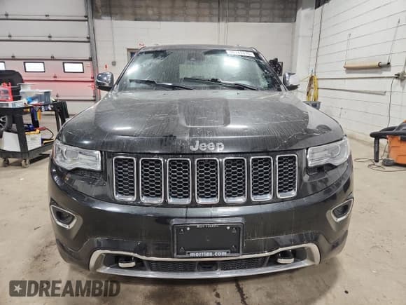 ✅ 2014 Jeep Grand Cherokee Overland • VIN: 1C4RJFCG9EC339863 • Lot: 90741315. Listed on Copart with 143,485 mi. Free auction sales archive from the USA and detailed vehicle history report at DreamBid. Image 5.