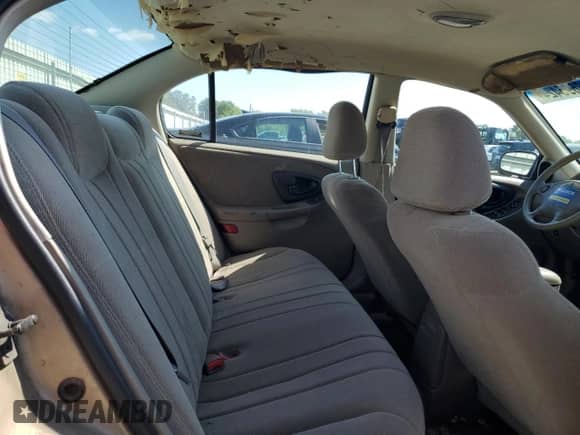 2001 Chevrolet Malibu z VIN 1G1ND52J216123769, wystawiony jako Copart lot #68695424 z przebiegiem 85 381 mil mil oraz Szkoda całkowita • Salvage title. Historia ofert i sprzedaży dostępna na DreamBid. Obrazek 10.