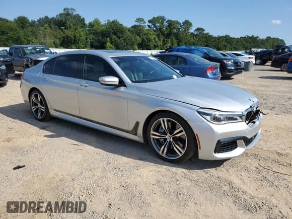 ✅ 2018 BMW 7 Series 750i • VIN: WBA7F0C5XJGM23968 • Лот: 71518115. Опубликован ранее на Copart с пробегом 64 569 миль. Бесплатный доступ к архиву аукционных продаж из США и подробный отчёт об истории автомобиля на DreamBid. Изображение 4.