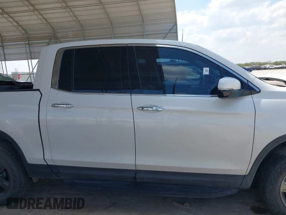 ✅ 2023 Honda Ridgeline RTL-E • VIN: 5FPYK3F72PB035287 • Lot: 43234228. Listed on IAAI with 15,634 mi. Free auction sales archive from the USA and detailed vehicle history report at DreamBid. Image 13.