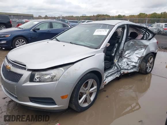 2014 Chevrolet Cruze 2LT with VIN 1G1PE5SB0E7135532, listed as a IAAI auction lot 43507178 with 100,363 mi miles and . Bid and sale history available at DreamBid. Image 2.