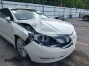 ✅ 2013 Lincoln MKZ • VIN: 3LN6L2G96DR805178 • Lot: 42915934. Wystawiony na IAAI z przebiegiem 158 757 mil. Bezpłatny archiwum sprzedaży aukcyjnych z USA i szczegółowy raport historii pojazdu na DreamBid. Zdjęcie 6.