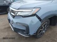 ✅ 2022 Honda Pilot Touring 7-Passenger • VIN: 5FNYF6H68NB056077 • Lot: 42357338. Listed on IAAI with 18,193 mi. Free auction sales archive from the USA and detailed vehicle history report at DreamBid. Image 6.