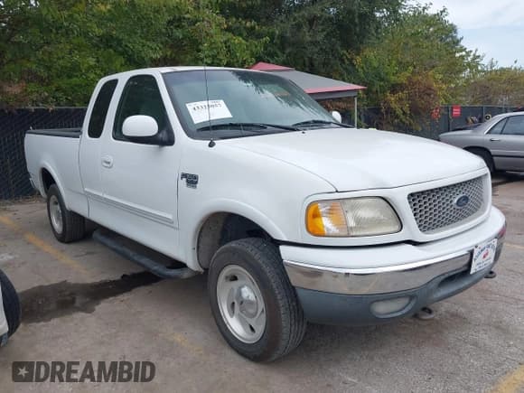 ✅ 1999 Ford F-150 • VIN: 1FTRX18W5XNB87105 • Lot: 43325057. Listed on IAAI with 159,328 mi. Free auction sales archive from the USA and detailed vehicle history report at DreamBid. Image 1.