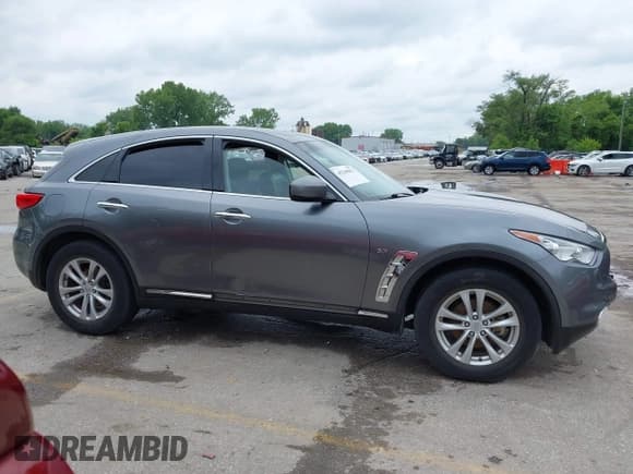 ✅ 2017 Infiniti QX70 • VIN: JN8CS1MU4HM141785 • Lot: 42345827. Listed on IAAI with 123,947 mi. Free auction sales archive from the USA and detailed vehicle history report at DreamBid. Image 13.