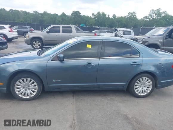 ✅ 2012 Ford Fusion Hybrid • VIN: 3FADP0L39CR222565 • Лот: 42671258. Опубликован ранее на IAAI с пробегом 207 566 миль. Бесплатный доступ к архиву аукционных продаж из США и подробный отчёт об истории автомобиля на DreamBid. Изображение 13.