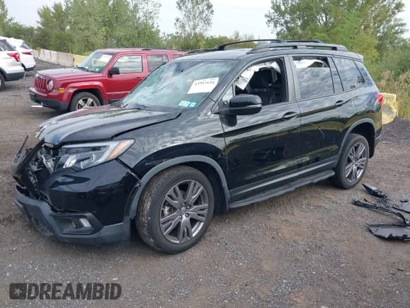 ✅ 2020 Honda Passport EX-L • VIN: 5FNYF8H54LB000055 • Lot: 43319655. Listed on IAAI with 14,502 mi. Free auction sales archive from the USA and detailed vehicle history report at DreamBid. Image 2.