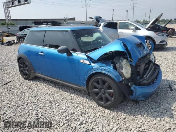 2007 MINI Hardtop S with VIN WMWMF73547TT84449, listed as a Copart auction lot 60490995 with 157,602 mi miles and Salvage title. Bid and sale history available at DreamBid. Image 4.