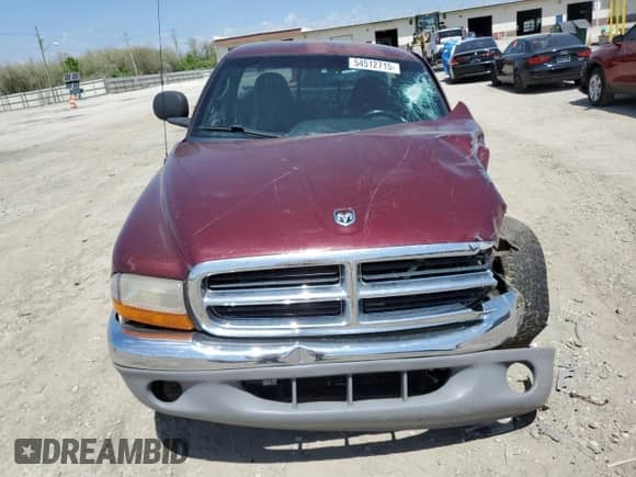 2000 Dodge Dakota Sport z VIN 1B7GG26N5YS546673, wystawiony jako Copart lot #54512715 z przebiegiem 140 904 mil mil oraz Czysty tytuł • Clean title. Historia ofert i sprzedaży dostępna na DreamBid. Obrazek 5.