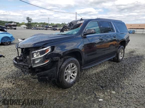 2019 Chevrolet Suburban LT with VIN 1GNSKHKC6KR202548, listed as a Copart auction lot 60195714 with 156,087 mi miles and Salvage title. Bid and sale history available at DreamBid. Image 1.