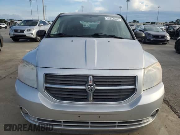 2012 Dodge Caliber SXT z VIN 1C3CDWDA5CD533597, wystawiony jako Copart lot #73834484 z przebiegiem 94 908 mil mil oraz Szkoda całkowita • Salvage title. Historia ofert i sprzedaży dostępna na DreamBid. Obrazek 5.