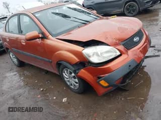 ✅ 2009 Kia Rio LX • VIN: KNADE223596580617 • Lot: 43727560. Listed on IAAI with 243,386 mi. Free auction sales archive from the USA and detailed vehicle history report at DreamBid. Image 1.