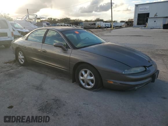 ✅ 1999 Oldsmobile Aurora • VIN: 1G3GR62C8X4116452 • Lot: 84070784. Listed on Copart with 92,526 mi. Free auction sales archive from the USA and detailed vehicle history report at DreamBid. Image 4.