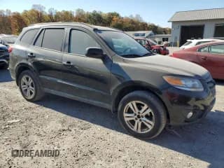 ✅ 2012 Hyundai Santa Fe SE • VIN: 5XYZHDAG2CG127768 • Lot: 77075924. Listed on Copart with 149,980 mi. Free auction sales archive from the USA and detailed vehicle history report at DreamBid. Image 4.