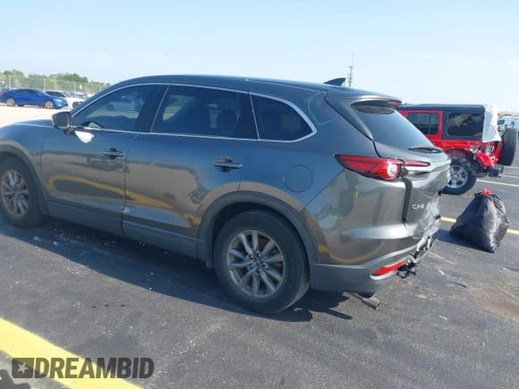 ✅ 2021 Mazda CX-9 Touring • VIN: JM3TCACYXM0511613 • Lot: 42294802. Listed on IAAI with 49,105 mi. Free auction sales archive from the USA and detailed vehicle history report at DreamBid. Image 3.
