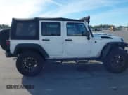 ✅ 2014 Jeep Wrangler Unlimited Sport • VIN: 1C4BJWDG1EL154948 • Лот: 43674003. Опубликован ранее на IAAI с пробегом 101 988 миль. Бесплатный доступ к архиву аукционных продаж из США и подробный отчёт об истории автомобиля на DreamBid. Изображение 13.
