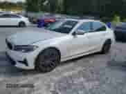 2021 BMW 3 Series 330i with VIN 3MW5R1J04M8B91740, listed as a Copart auction lot 64383555 with 77,484 mi miles and Salvage title. Bid and sale history available at DreamBid. Image 1.